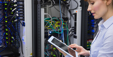 Technician analyzing mission critical equipment