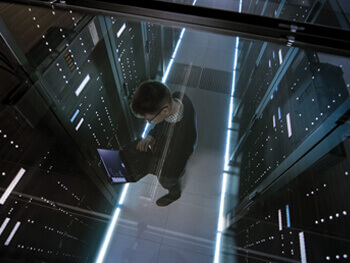Aerial view of technician inside a data center